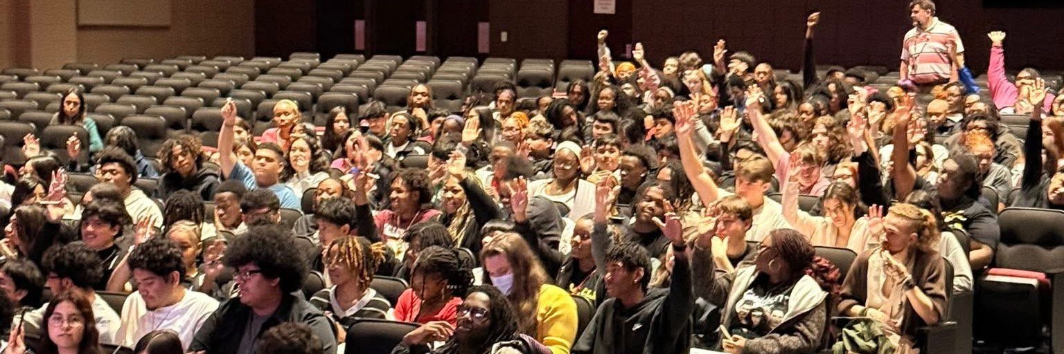 A Democracy Trailblazers school assembly. Hands up from students who had not registered yet.